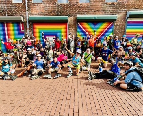 pride and unity skate group picture at love mural