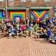 pride and unity skate group picture at love mural